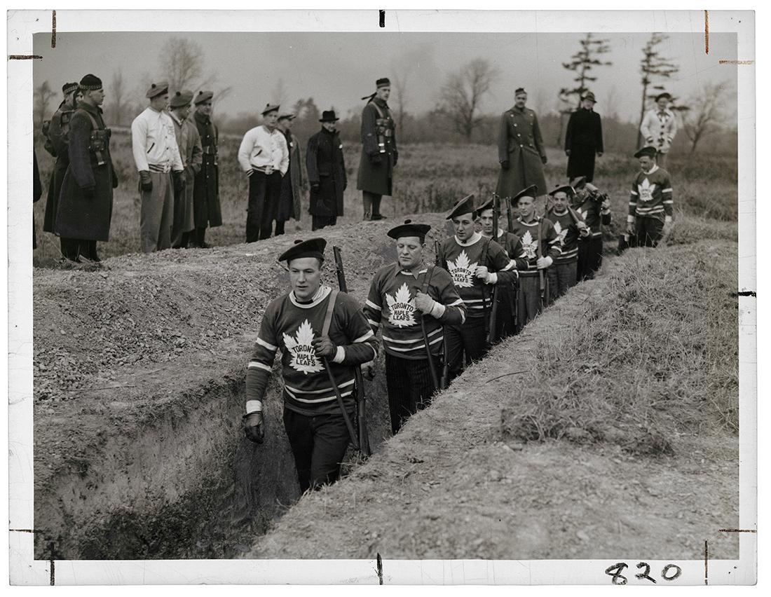 A photograph of the Maple Leafs hockey team training in the trenches for the war