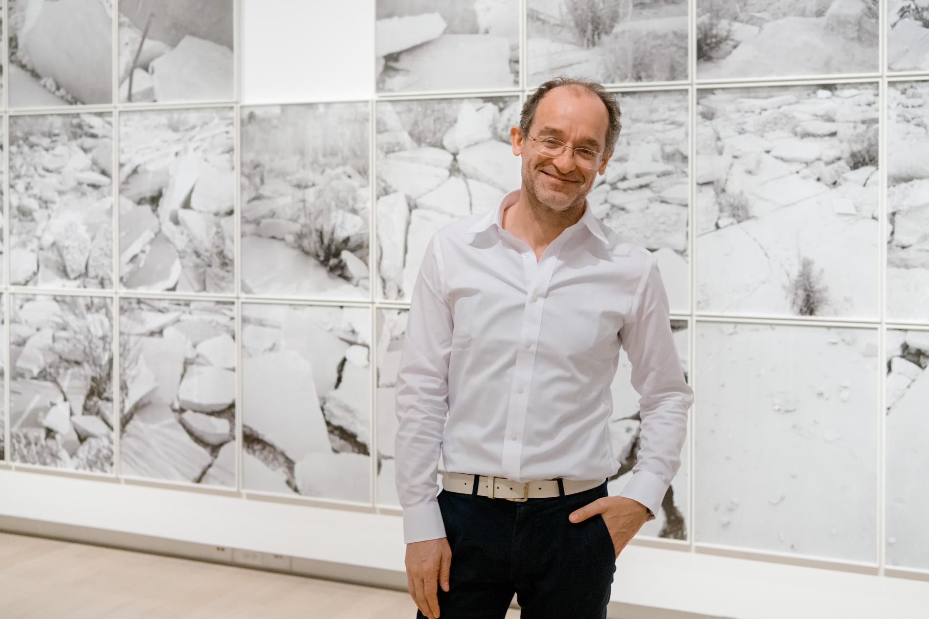 Curator David Campany photographed in the exhibition, A Handful of Dust.