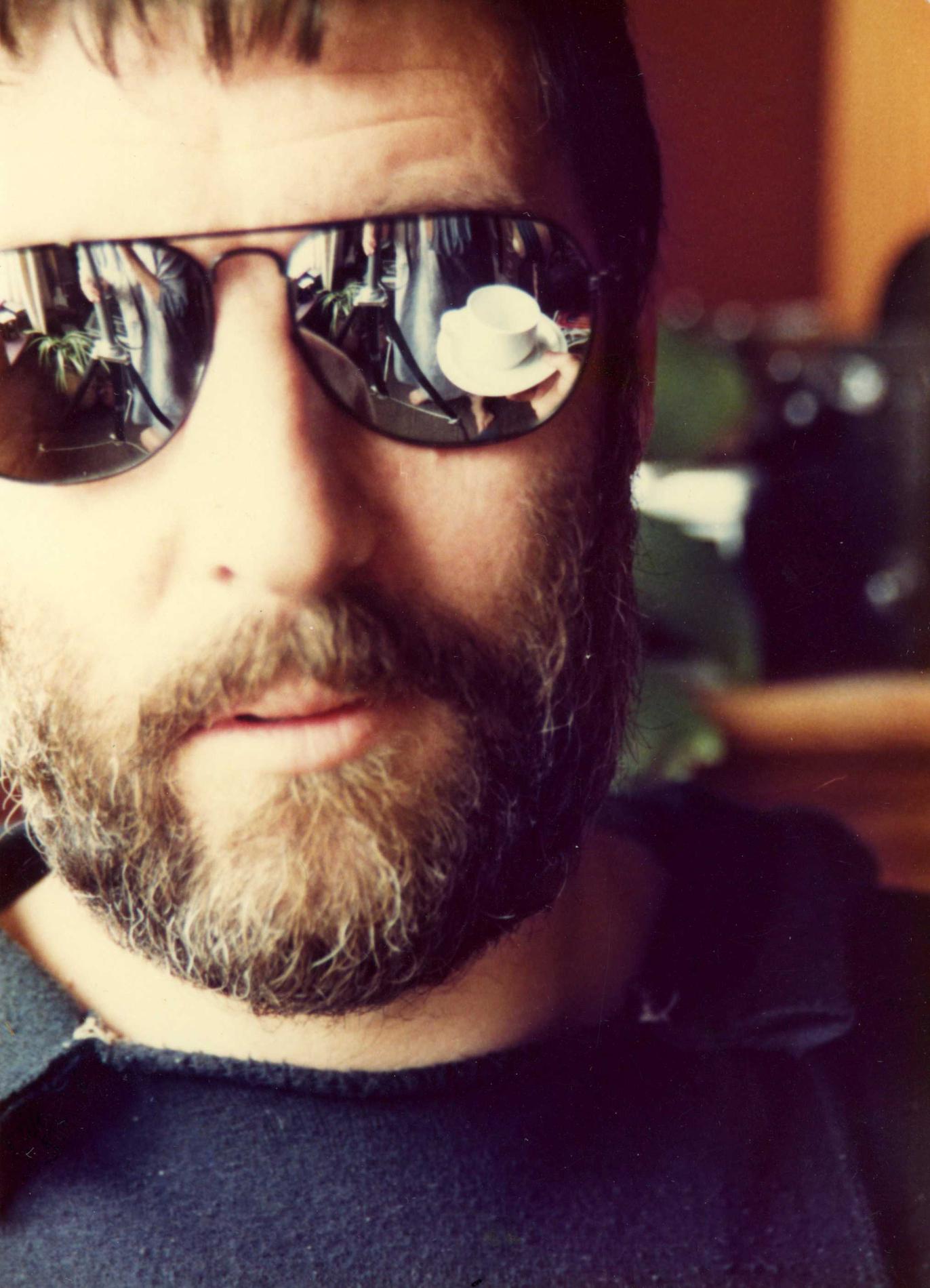 A man in reflective sunglasses
