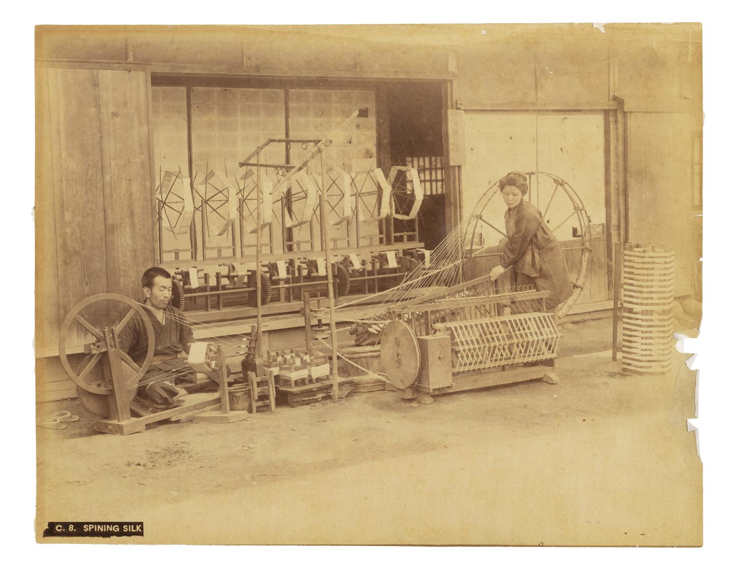 Two people spinning silk in Japan