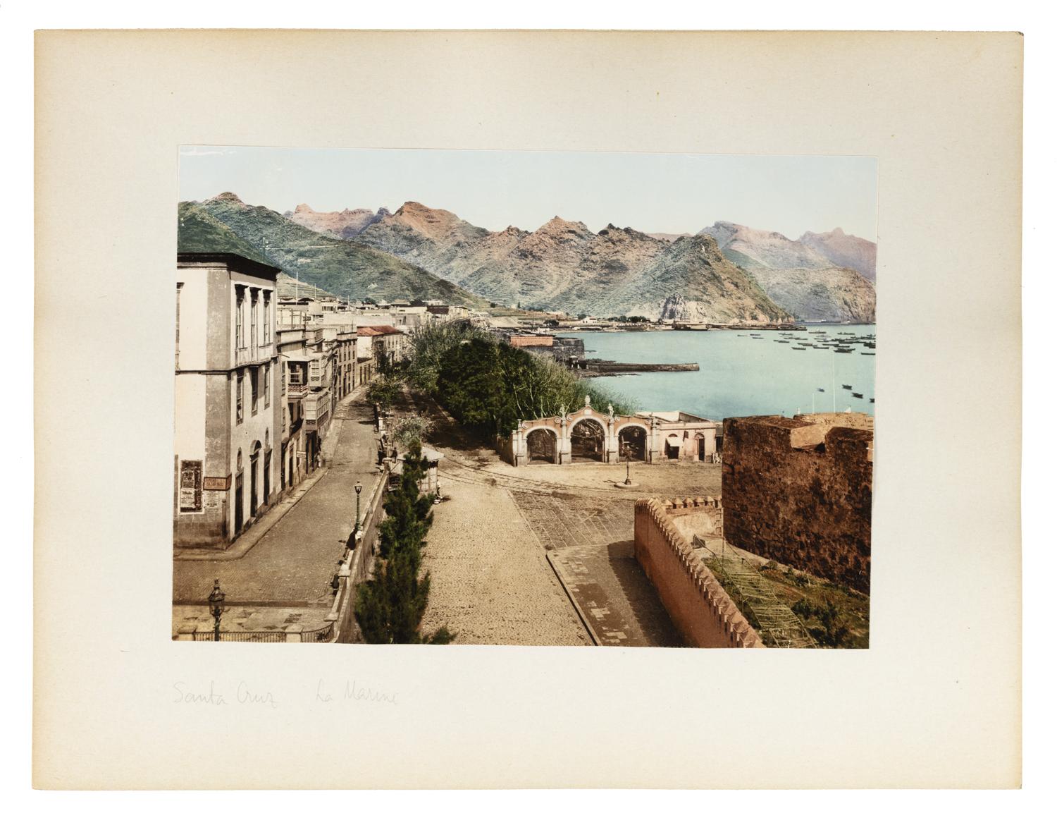 A colour photograph showcasing the houses and streets and coastal landscape of Tenerife, Spain.