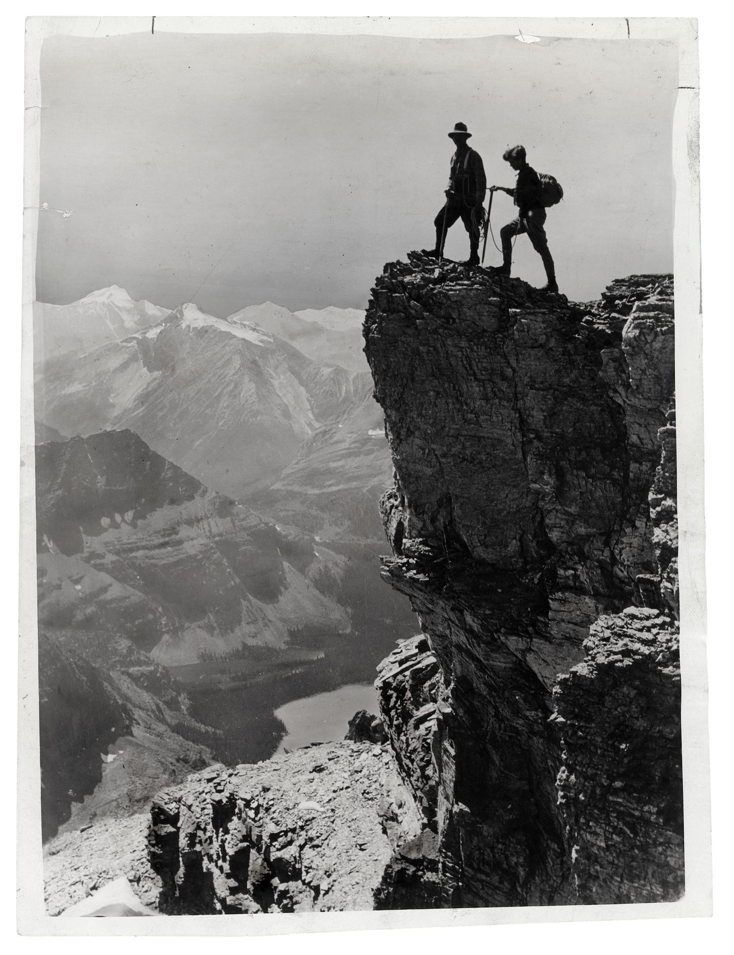 Miss Georgia Englehard scales her fifty-sixth peak in the Canadian Rockies with Ernest Feuz, her Swiss guide, Mount Victoria, British Columbia, Canada in 1933.