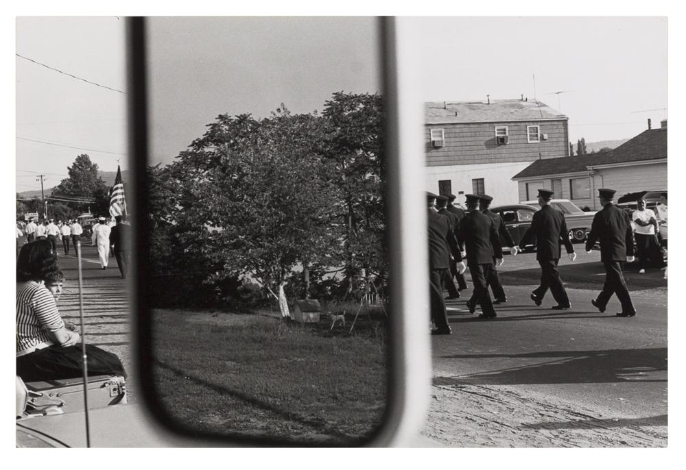 Photo of marching men taken through car mirror in Stony Point, New York in 1966.
