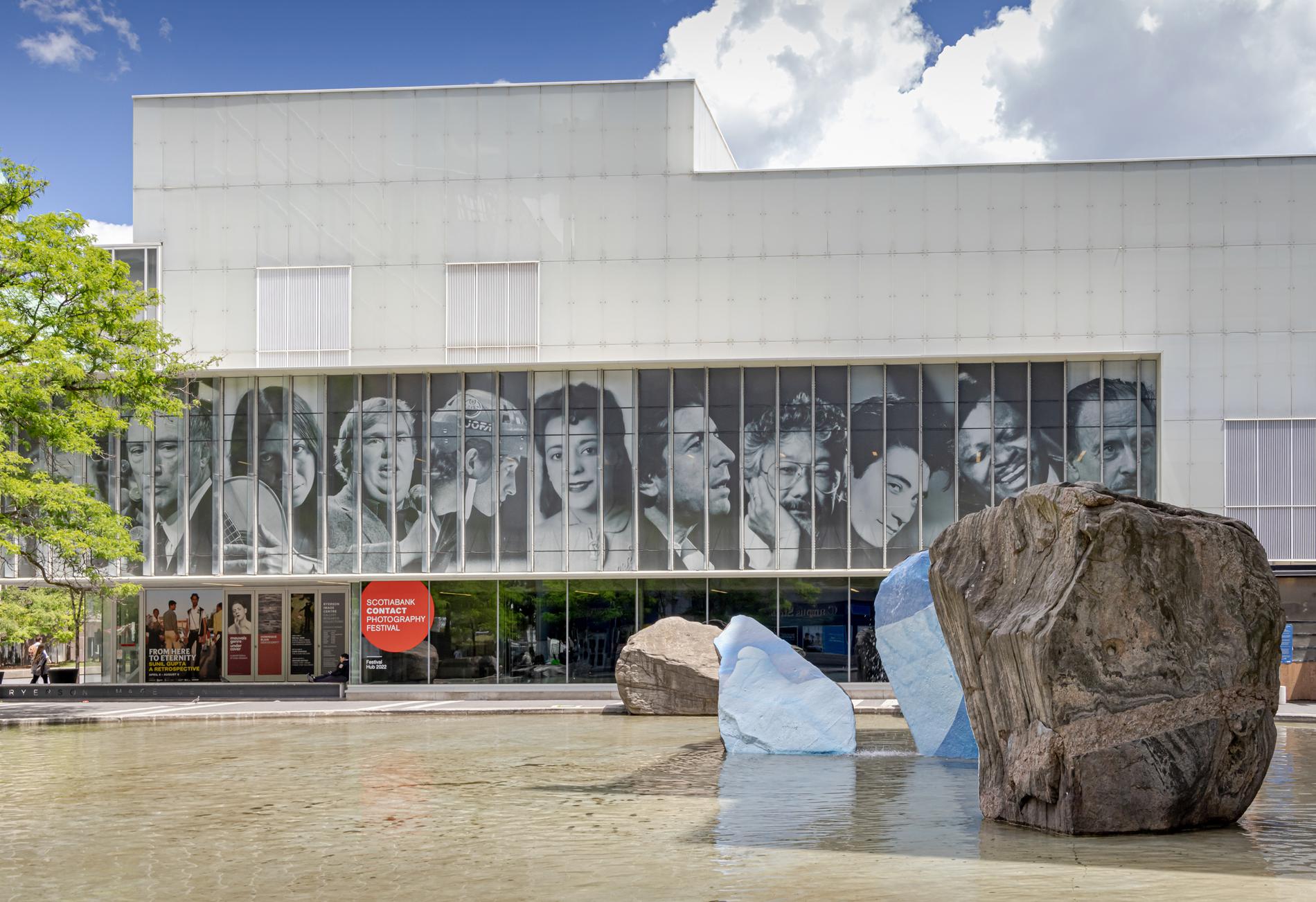 Front exterior of The Image Centre featuring installation on rocks in pond adjacent