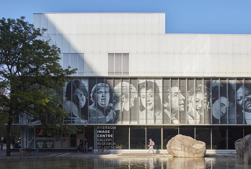 A photograph of the RIC's exterior façade, featuring portraits of well-known Canadians.