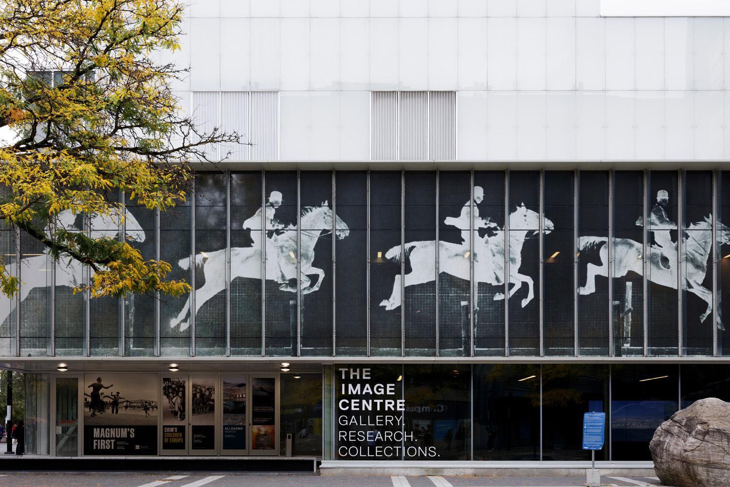 Front exterior of The Image Centre featuring a photographic negative mural of a horse in motion