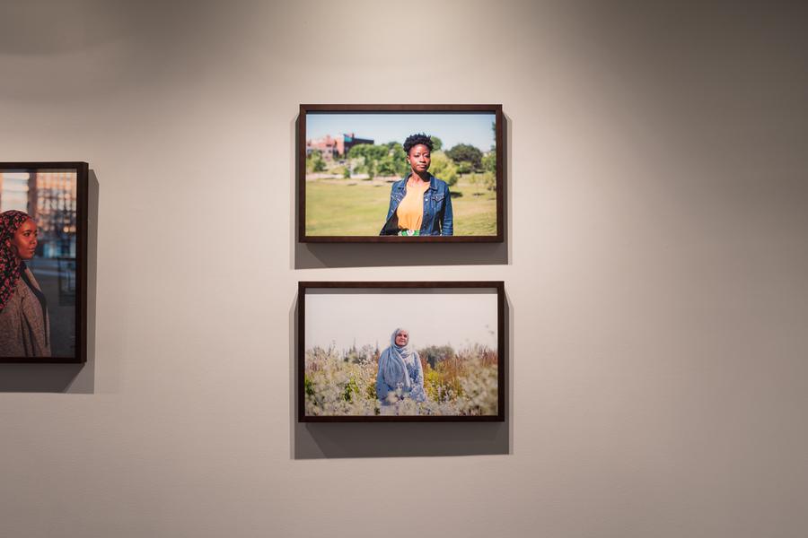 Framed photographs hanging on a wall