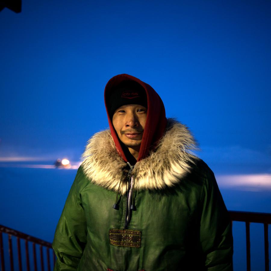 A portrait of a man in winter at night