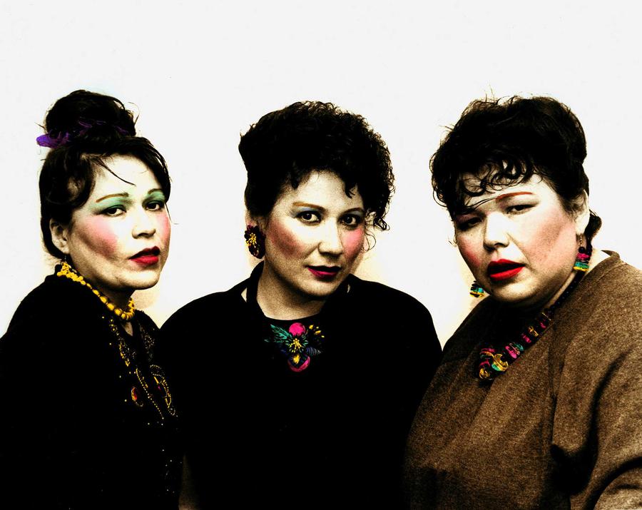 Three women posing wearing what looks like makeup that has been photoshopped on