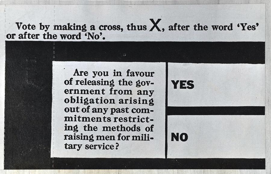 Black text on white paper reads "vote by making a cross, thus X, after the word 'yes' or after the word 'no'. Are you in favour of releasing the government from any obligation arising out of any past commitments restricting the methods of raising men for military service? Yes. No."