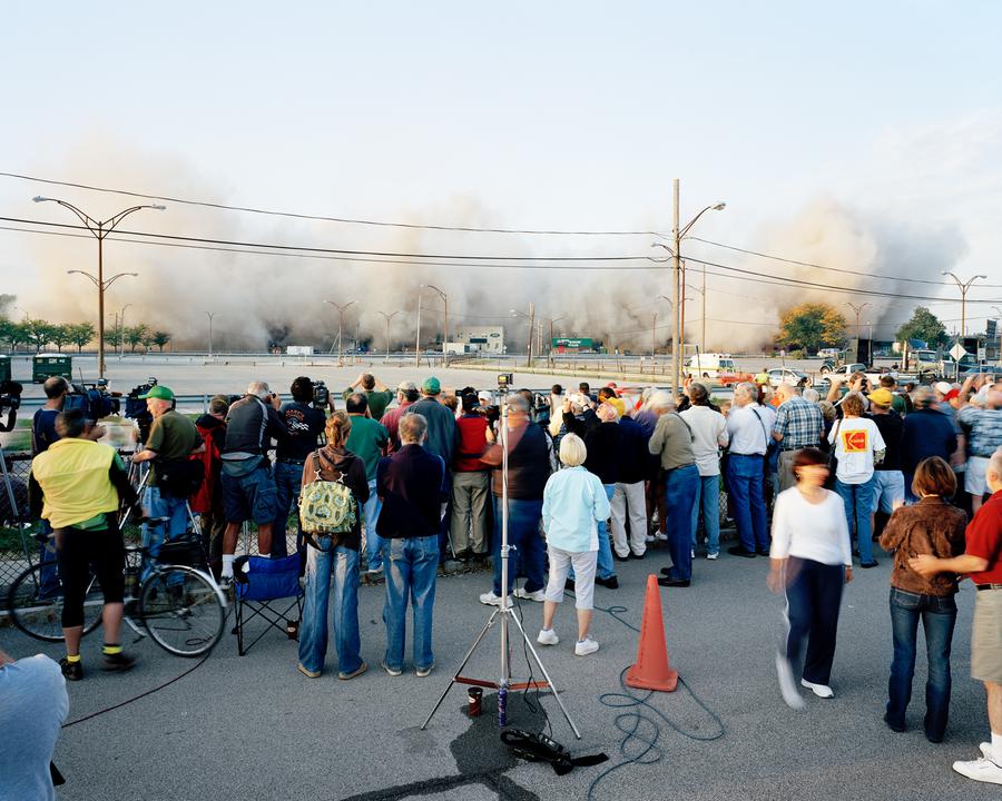 A group watches as one of the Kodak buildings is demolished.