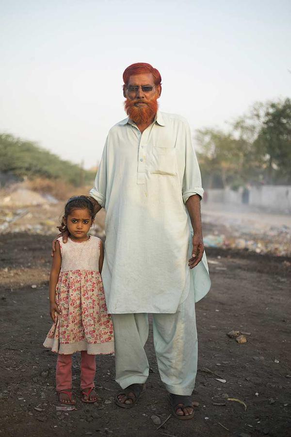 Portrait of an older man and young girl