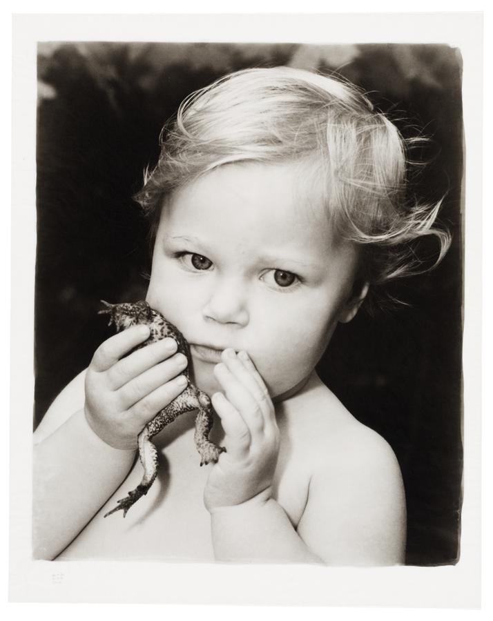 A little girl, Jazimina, with a toad.