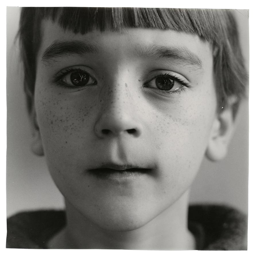Close-up of a little boy with freckles.