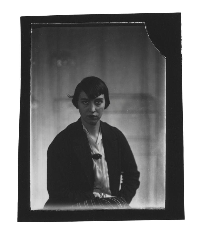Self-portrait of Berenice Abbott wearing a blazer.