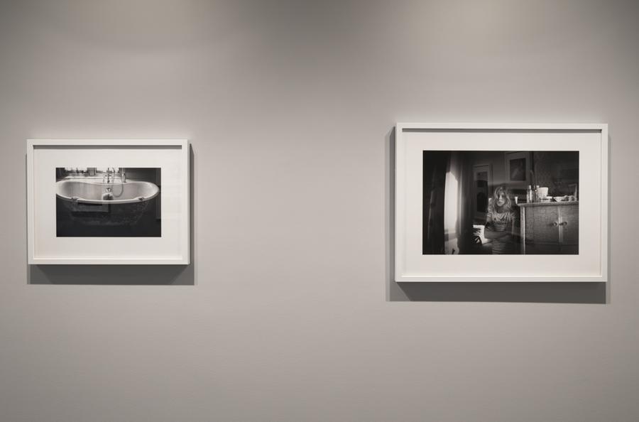 Two framed photographs hanging on a wall