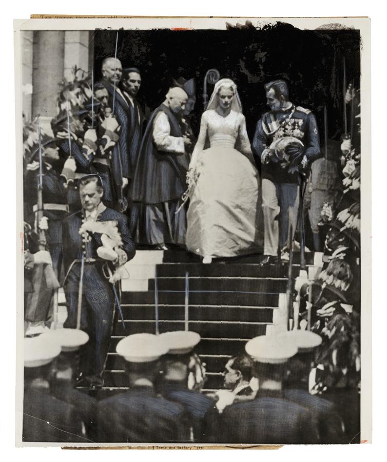 woman in wedding dress and man in military regalia exit on church steps, surrounded by other armed men in military regalia holding swords.