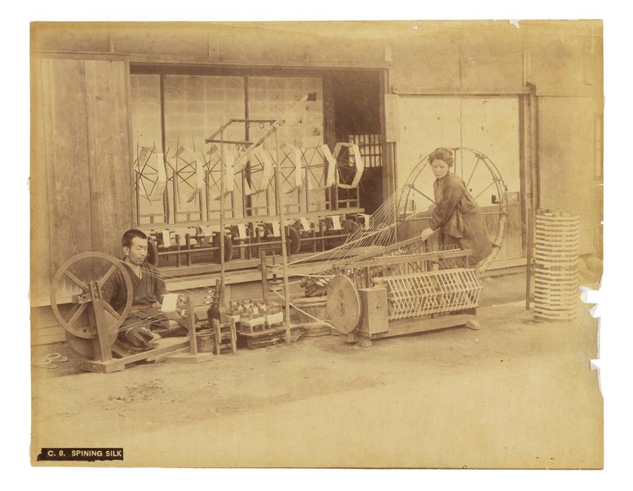 Two people spinning silk in Japan