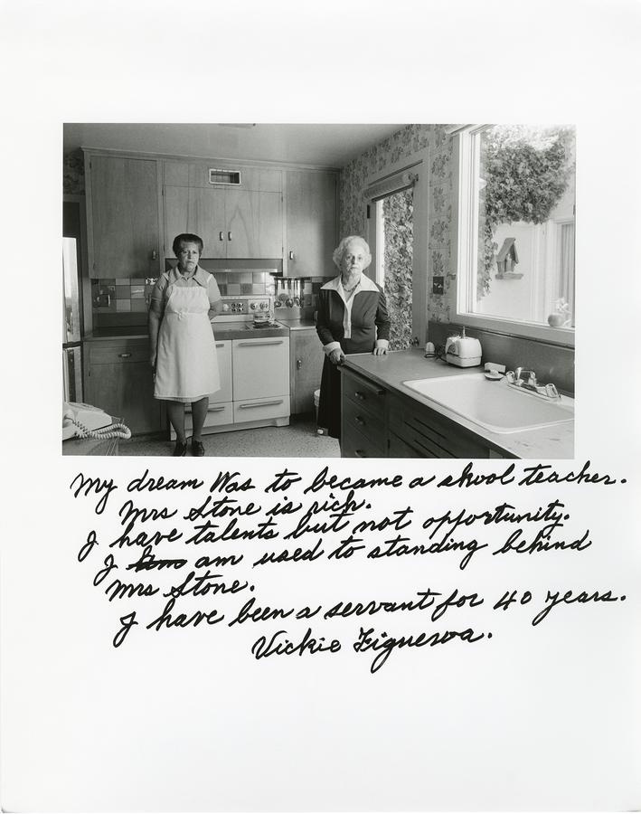 Two women standing in a kitchen