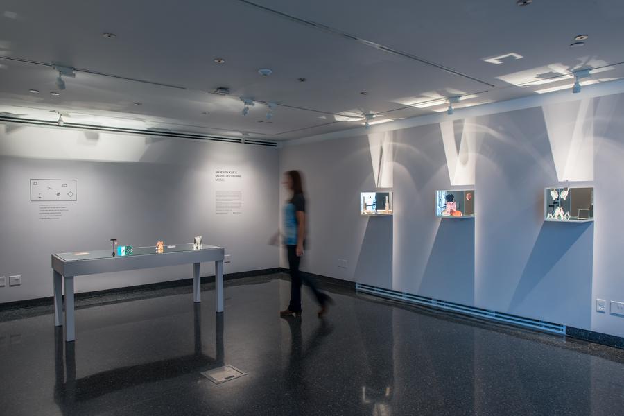 Wide shot of the Student Gallery, a white display case in the centre
