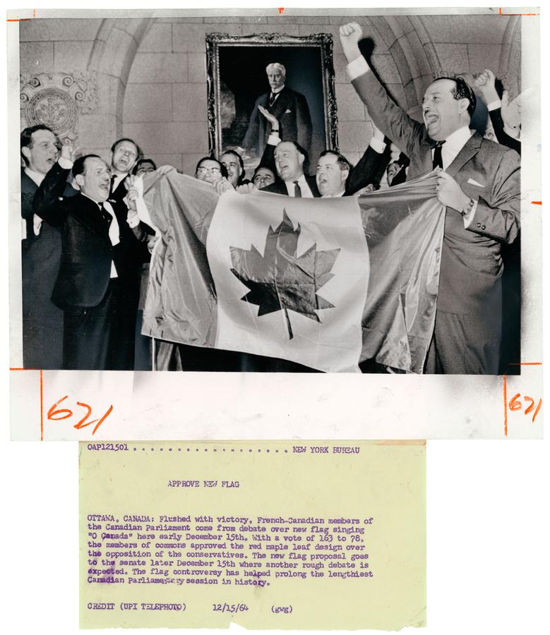 Members of Canadian Parliament singing "O Canada" while displaying newly approved flag design, Ottawa, Ontario in 1964.