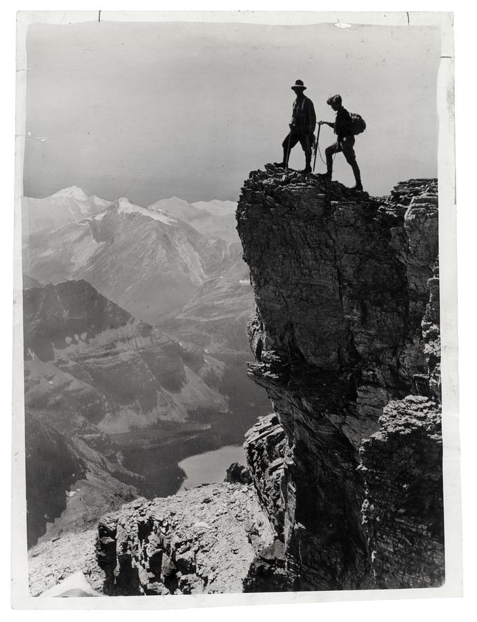 Miss Georgia Englehard scales her fifty-sixth peak in the Canadian Rockies with Ernest Feuz, her Swiss guide, Mount Victoria, British Columbia, Canada in 1933.
