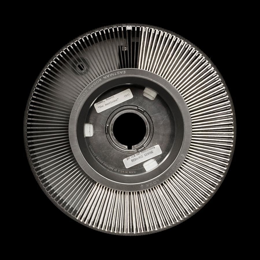 Image of a slide projector reel.