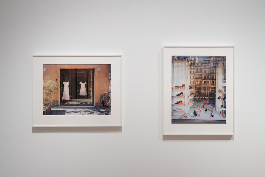 installation photo of two frames holding images of storefront windows
