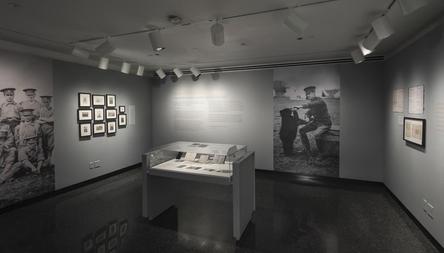 Gallery with grey walls and a display case in the center