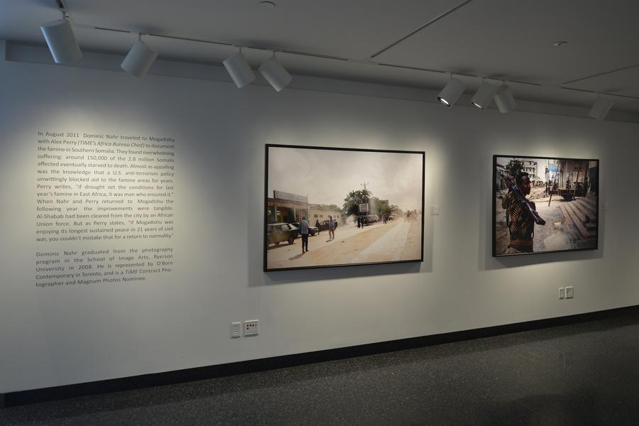 Two large photographs with exhibition text on the left