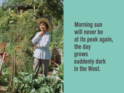 Woman in a garden wearing a straw hat and holding her body and neck in contemplation