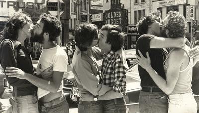 3 gay couples kissing in the street